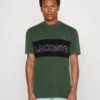 Lacoste Unisex - T-Shirt Imprimé - Vert Fonce/Bleu Marine
